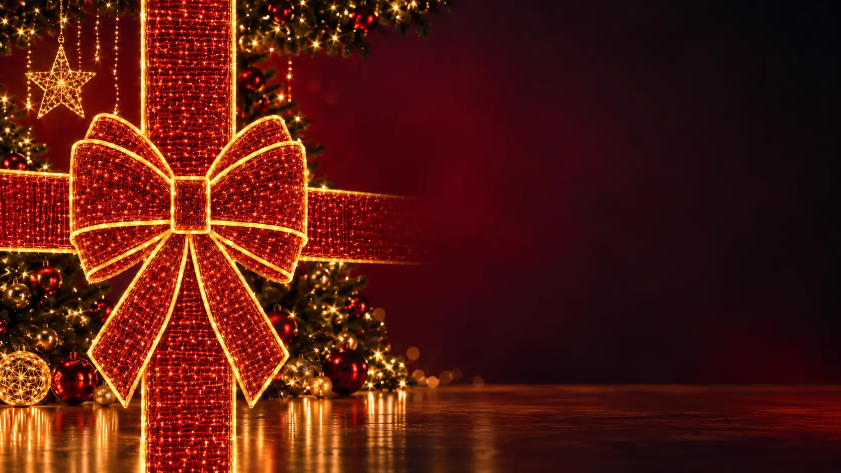 Portada navideña de Vaelza 2026 con un gran lazo luminoso rojo, luces doradas y árbol de Navidad